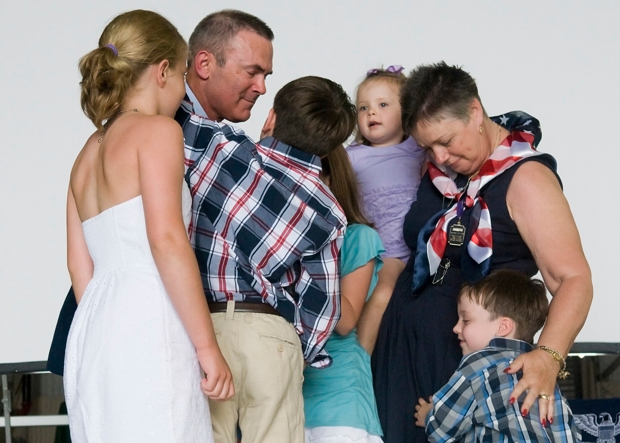 GRISSOM AIR RESERVE BASE, Ind. -- Col. William T. "Tim" Cahoon and his wife Vicki are embraced by their grandchildren shortly after Cahoon?s retirement ceremony here May 20. Cahoon retired after 35 years in the Air Force. (U.S. Air Force photo/Senior Airman Jami K. Lancette)