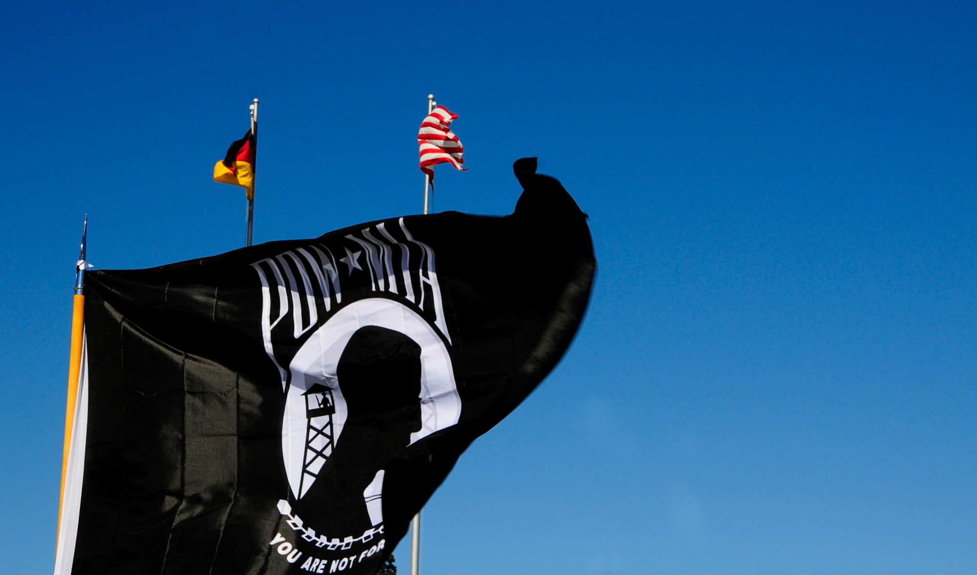 A POW/MIA flag waves at a retreat formation here May 25. Base members participated in a POW/MIA memorial run that was held to honor all military prisoners of war and those missing in action. It had about 350 participants and the memorial flag traveled a total of 151.2 miles. (U.S. Air Force photo/Airman 1st Class Hailey Haux)