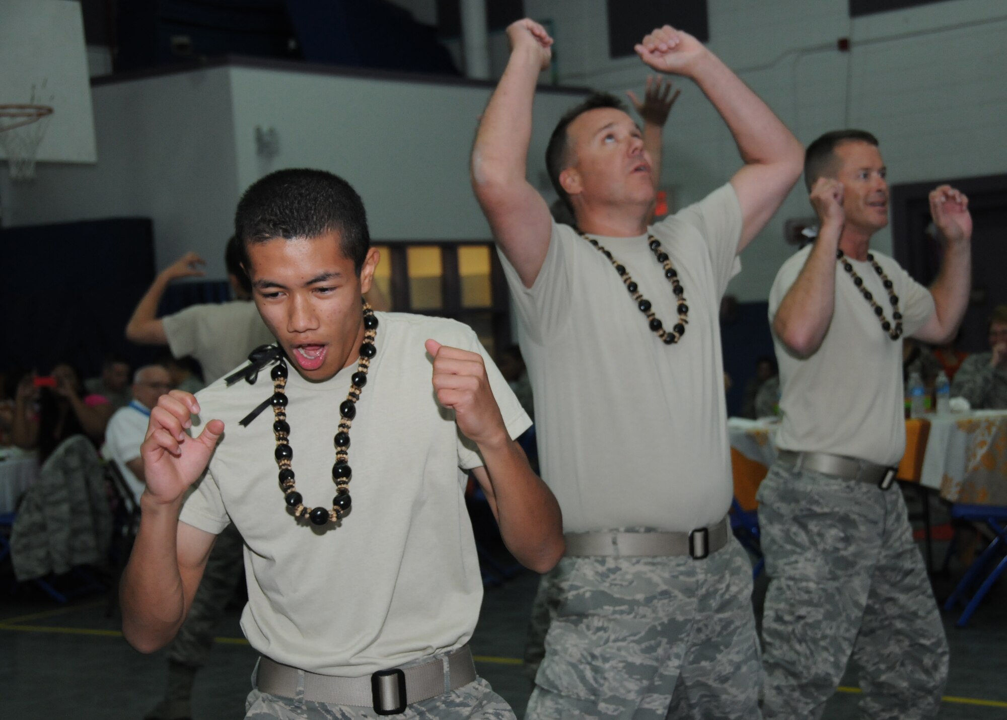 Airman 1st Class Earl Pecson, 81st Diagnostic and Therapeutics Squadron, Lt. Col. Jeffrey McLemore, 334th Training Squadron commander, and Lt. Col. Brian Worth, 336th Training Squadron commander, participate in the south Pacific dance, Haka, at the Asian-Pacific American Heritage cultural extravaganza at the Youth Center May 22, 2012, Keesler Air Force Base, Miss.  Haka is a warrior dance designed to intimidate opponents.  In addition to the variety of cultural dances performed, there was a food tasting and a fashion show.   (U.S. Air Force photo by Kemberly Groue)