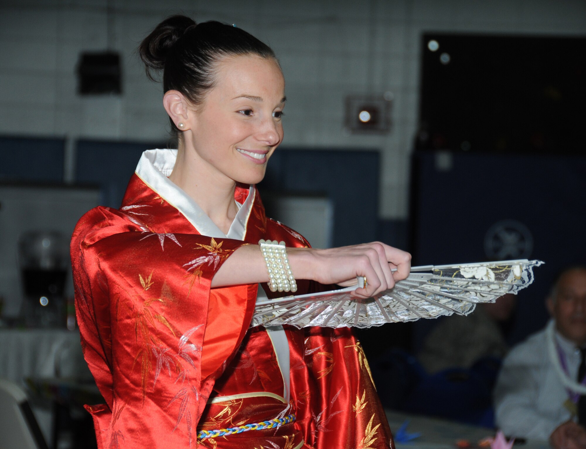 Staff Sgt. Amber Oaks, 334th Training Squadron, wears a Chinese Kimono during the fashion show at the Asian-Pacific American Heritage cultural extravaganza at the Youth Center May 22, 2012, Keesler Air Force Base, Miss. In addition to the fashion show there was also a food tasting and a variety of cultural dances performed.  (U.S. Air Force photo by Kemberly Groue)