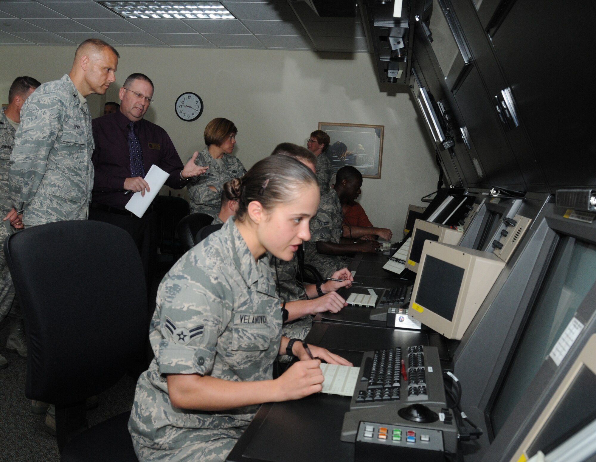 Brig. Gen. Bradley Spacy, 81st Training Wing commander, receives a briefing from Keith Gunn, 334th Training Squadron, on the air traffic control radar systems course May 22, 2012, at Cody Hall, Keesler Air Force Base, Miss.  Spacy visited the 81st Training Group to gain an understanding of their mission, operations and personnel.  (U.S. Air Force photo by Kemberly Groue)
