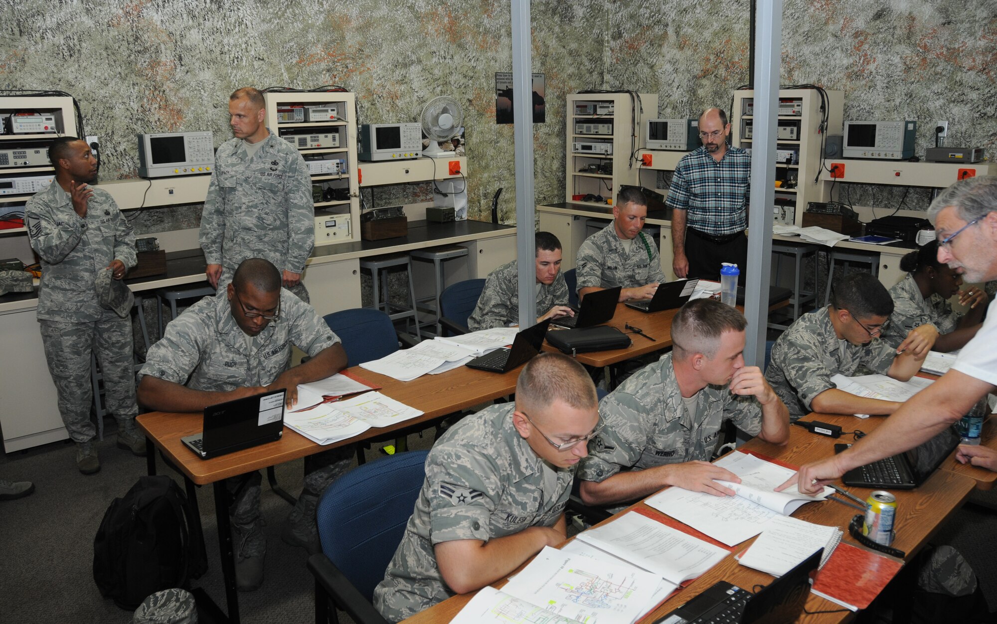 Master Sgt. Albrecco Jackson, 338th Training Squadron, takes Brig. Gen. Bradley Spacy, 81st Training Wing commander, on a tour inside a radio frequency transmissions course classroom at Jones Hall, during Spacy’s tour of the 81st Training Group May 22, 2012, at Keesler Air Force Base, Miss.  Spacy visited the 81st Training Group to gain an understanding of their mission, operations and personnel.  (U.S. Air Force photo by Kembelry Groue)