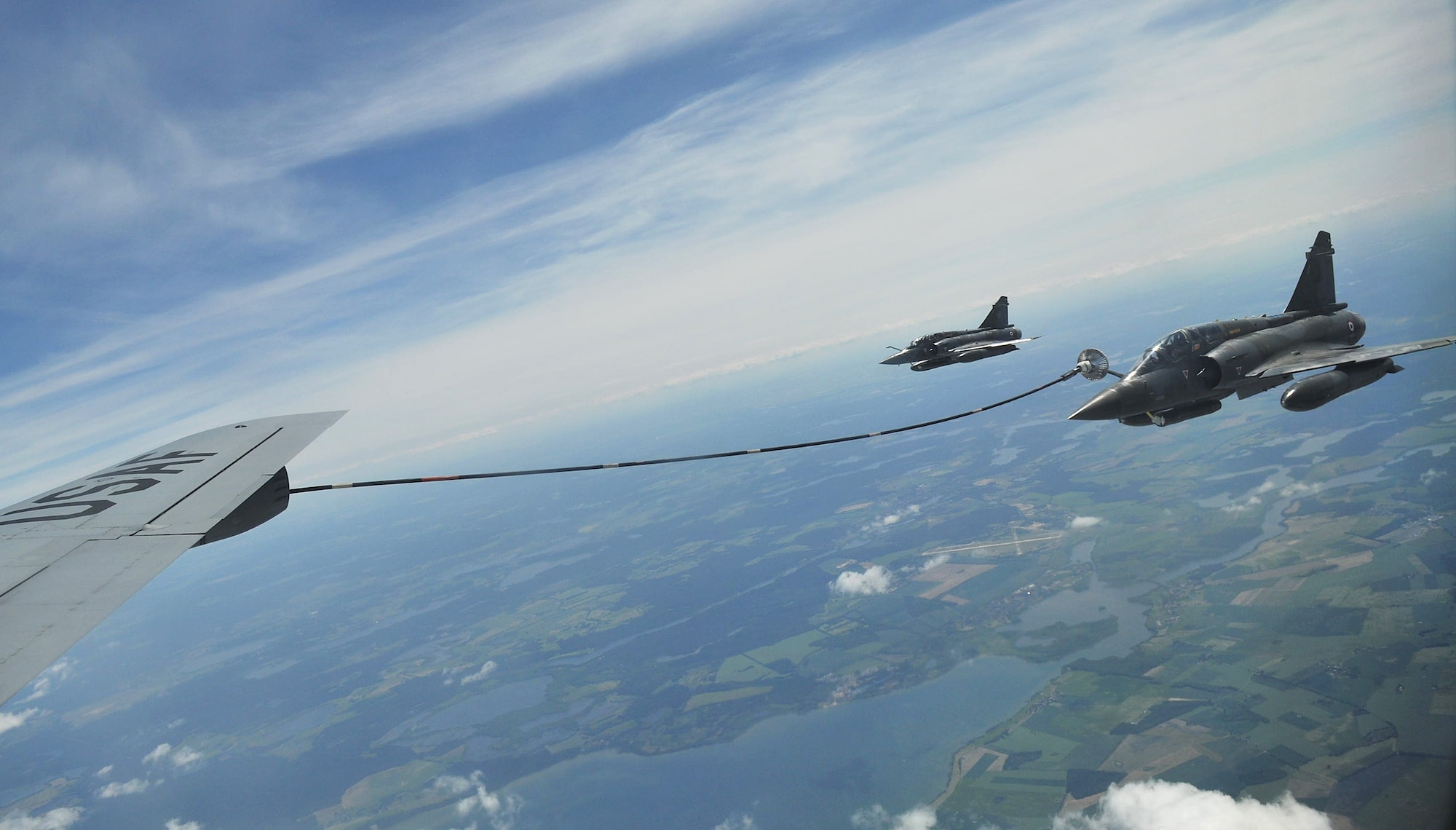 GERMANY – A French Dassault Mirage 2000 aircraft receives fuel off the wing of an RAF Mildenhall KC-135 Stratotanker over Germany May 29, 2012. The two French aircraft received more than 34,000 pounds of fuel on this mission while supporting the Baltic Region Training Event XII. Several countries participated in the event including the United States, France, Estonia and Latvia. (U.S. Air Force photo/Senior Airman Jerilyn Quintanilla)