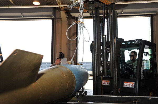U.S. Air Force Airman 1st Class Joshua Meidell, 35th Maintenance Squadron conventional maintenance crew member, operates a fork lift at Misawa Air Base, Japan, May 31, 2012. The fork lift is capable of moving more than 13,000 pounds of equipment. (U.S. Air Force photo by Airman Kenna Jackson/Released)