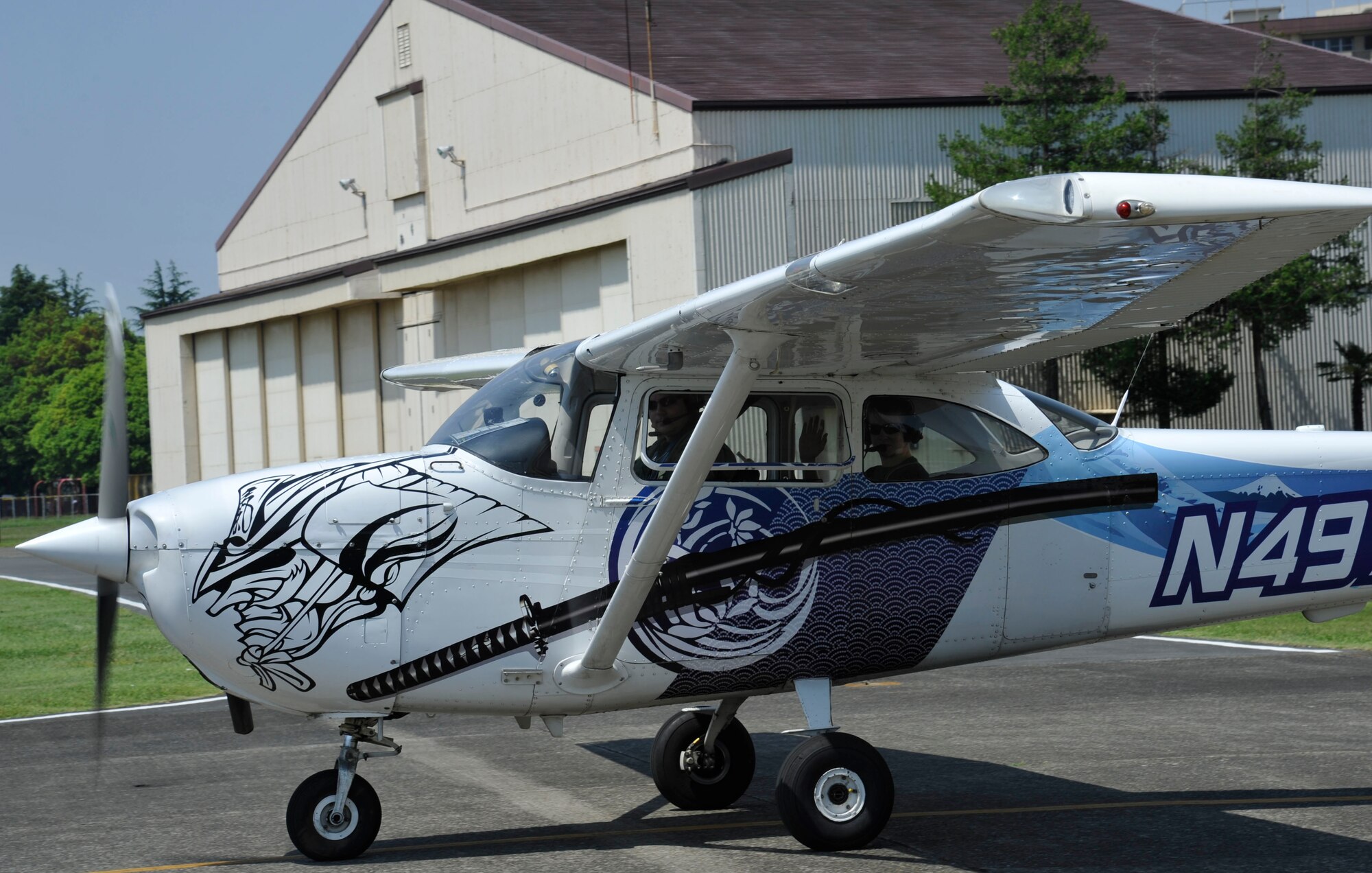 YOKOTA AIR BASE, Japan -- Civil Air Patrol cadets Airman 1st Class Michael McDougall and Airman Devin Geoffray, prepare for take-off in a Cessna 172 Skyhawk aircraft during an orientation flight at Yokota Air Base, Japan, May 19, 2012. Orientation flights are part of the CAP cadet program curriculum and familiarize cadets with general aviation and aerospace fundamentals. (U.S. Air Force photo by Senior Airman Andrea Salazar)