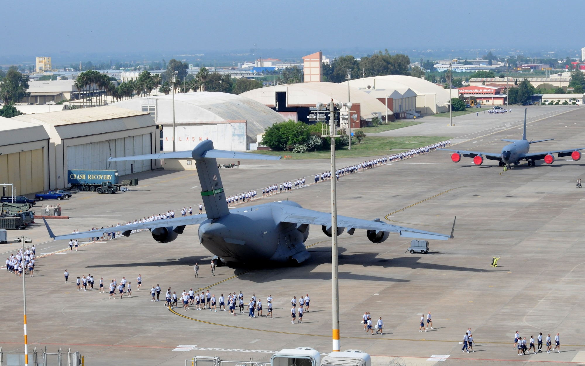 Airmen spread out around the flightline to begin a foreign-object-debris walk to remove trash and other objects from the area May 29, 2012, at Incirlik Air Base, Turkey. The FOD walk was a combined effort between the 39th Air Base Wing and Turkish air force 10th Tanker Base Command to clear the area of  debris that could potentially damage aircraft engines. (U.S. Air Force photo by Senior Airman Marissa Tucker/Released)
