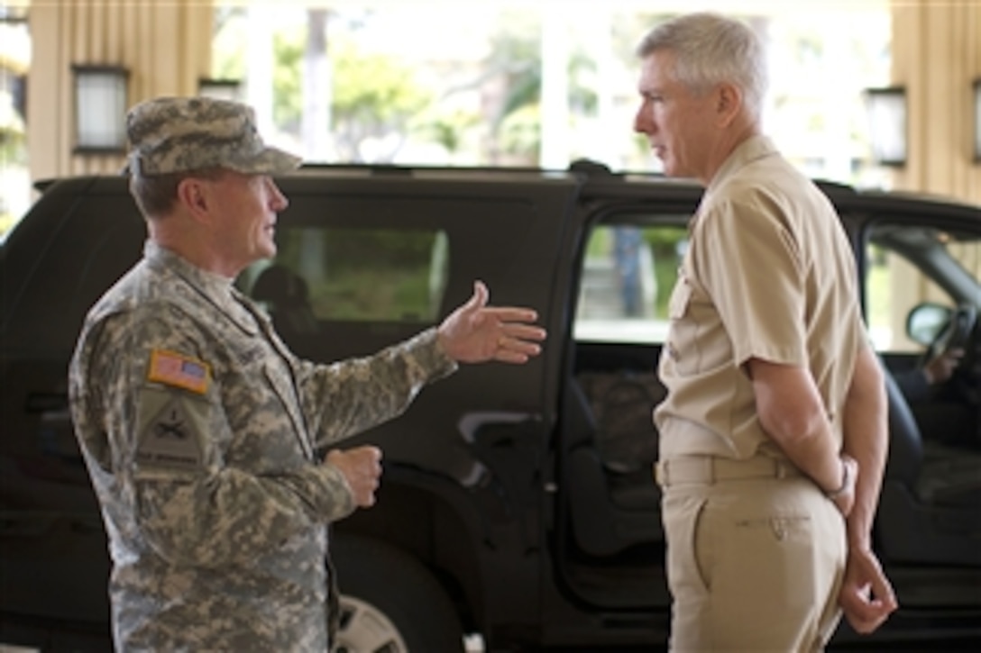 Chairman of the Joint Chiefs of Staff Gen. Martin E. Dempsey and Commander, U.S. Pacific Command Adm. Samuel J. Locklear pause to talk before Dempsey's departure from Camp Smith, Hawaii, on May 28, 2012.  