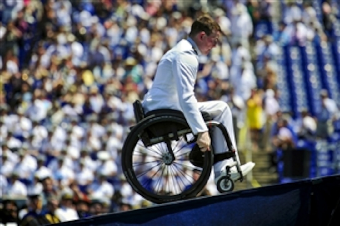 Navy Petty Officer 1st Class Kevin Hillery makes his way on stage to receive his diploma during the 2012 graduation ceremony at the U.S. Naval Academy in Annapolis, Md., May 29, 2012. Despite an accident in April that left him paralyzed, Hillery graduated from the academy. 