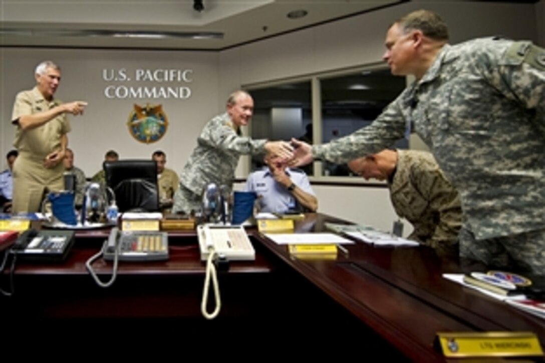 Navy Adm. Samuel J. Locklear III, left, commander of U.S. Pacific Command,  introduces senior members of his staff to Army Gen. Martin E. Dempsey, center, chairman of the Joint Chiefs of Staff, before a meeting at the command's headquarters on Camp H.M. Smith, Hawaii, May 30, 2012.