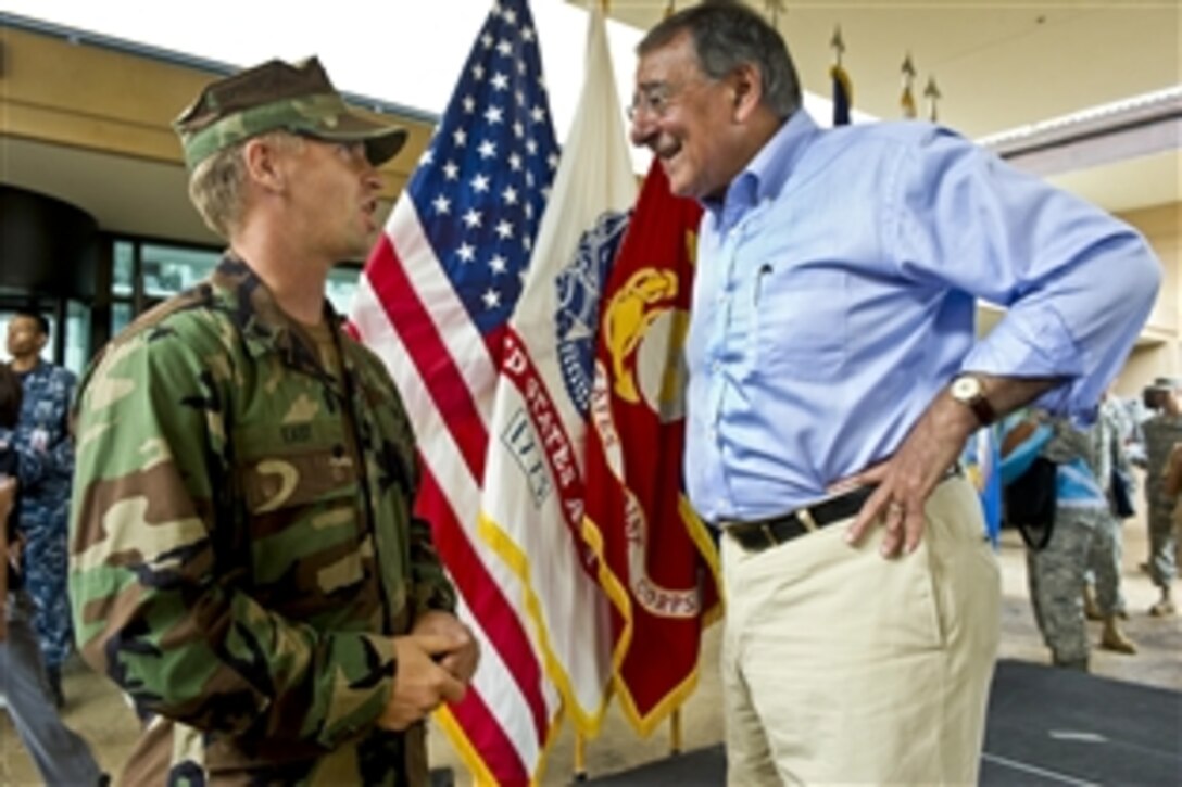 Defense Secretary Leon E. Panetta speaks with Navy Cmdr. Jared East during a visit to U.S. Pacific Command headquarters on Camp H.M. Smith, Hawaii, May 31, 2012. Panetta is on a 10-day trip to the Asia-Pacific region to meet with defense counterparts.