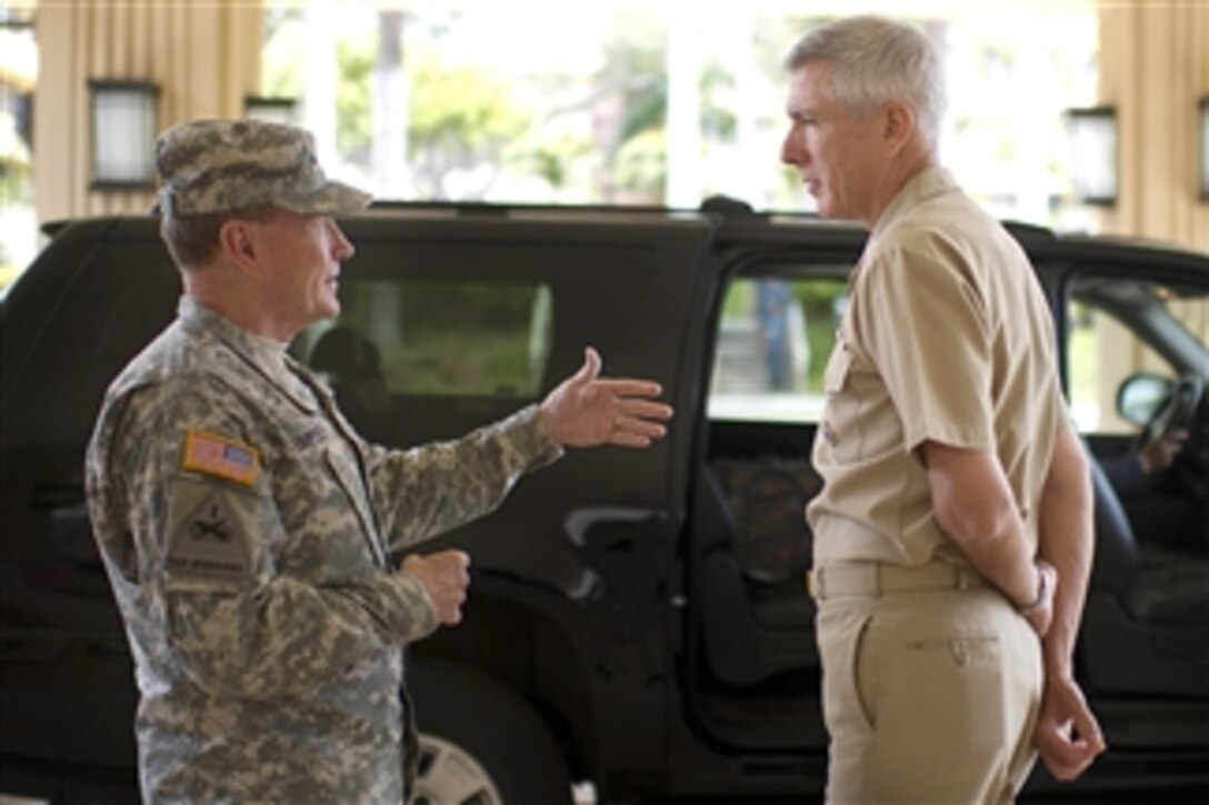 Chairman of the Joint Chiefs of Staff Gen. Martin E. Dempsey and Commander, U.S. Pacific Command Adm. Samuel J. Locklear pause to talk before Dempsey's departure from Camp Smith, Hawaii, on May 28, 2012.  