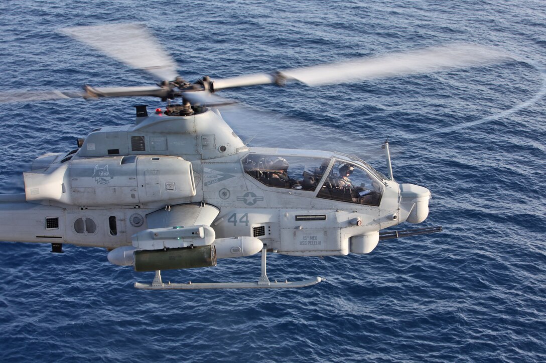 An AH-1Z Cobra from Marine Medium Helicopter Squadron 364, 15th Marine Expeditionary Unit, hovers above the flight deck of the USS Peleliu during Phibron 3 and the 15th MEU’s PHIBRON-MEU Interoperability Training exercise off the coast of Southern Calif., May 31. The exercise is the MEU’s first time at-sea as an entire Marine Air Ground Task Force and gives Marines and sailors the opportunity to become familiar working together as a blue-green team.