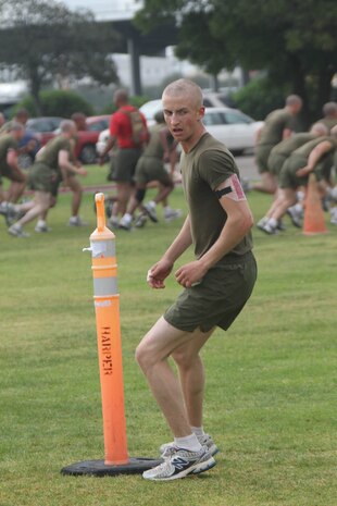 Recruits of Company A do speed and agility drills around the cones aboard Marine Corps Recruit Depot San Diego May 10. Recruits alternate running forward and backwards as they pass each cone.