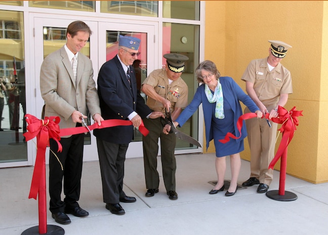 (left to right) Jeff Harper, president of Harper Construction Company Inc., Kenneth Walker, Brig. Gen. Daniel D. Yoo, commanding general, Marine Corps Recruit Depot San Diego and Western Recruiting Region, Nancy Walker, and Capt. Mark. A. Kobelja, deputy commander of Naval Medical Center San Diego, cut the red ribbon in front of Walker Hall May 10 aboard MCRD San Diego. Walker Hall is an energy-efficient, sports-medicine complex dedicated to Staff Sgt. Allan K. Walker, a former drill instructor who was killed in action April 6, 2004 in support of Operation Iraqi Freedom.
