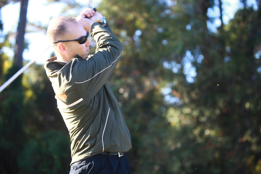 Capt. Erik A. Keim, the commanding officer of Communications Company, Combat Logistics Regiment 27, 2nd Marine Logistics Group, drives his ball down range at the Paradise Point golf course aboard Camp Lejeune, N.C., Oct 24, 2012. CLR-27 held the tournament as a fundraiser for its Marine Corps Birthday Ball.