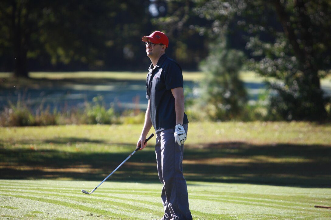 Navy Lt. Aaron G. Hassell, a dentist with the 2nd Dental Battalion, 2nd Marine Logistics Group, recovers after making a bad putt during a golf tournament held by Combat Logistics Regiment 27, 2nd MLG at Paradise Point golf course aboard Camp Lejeune, N.C., Oct. 24, 2012. The regiment organized the tournament as a fundraiser for its Marine Corps Birthday Ball and as a team-building exercise.