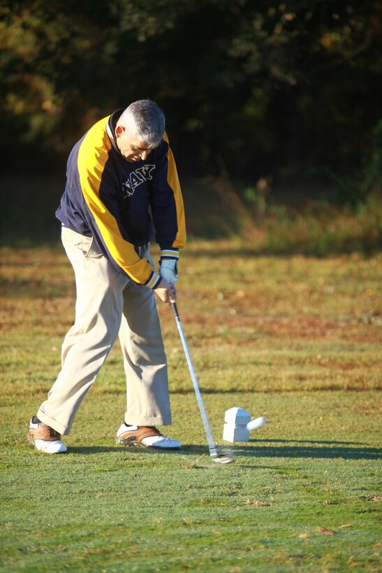 Navy Capt. Gregory N. Todd, the chaplain with 2nd Marine Logistics Group, drives a ball at the Paradise Point golf course aboard Camp Lejeune, N.C., Oct. 24, 2012. CLR-27 held the tournament as a fundraiser for its Marine Corps Birthday Ball and to build camaraderie within the unit.