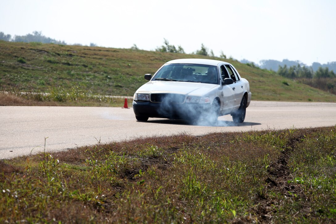 A Marine with Special-Purpose Marine Air-Ground Task Force Africa burns the tires while practicing high speed braking at the Tier 1 Group Training Facility in Crawfordsville, Ark., Oct. 13, 2012. Special-Purpose MAGTF Africa is training in preparation for its upcoming deployment.