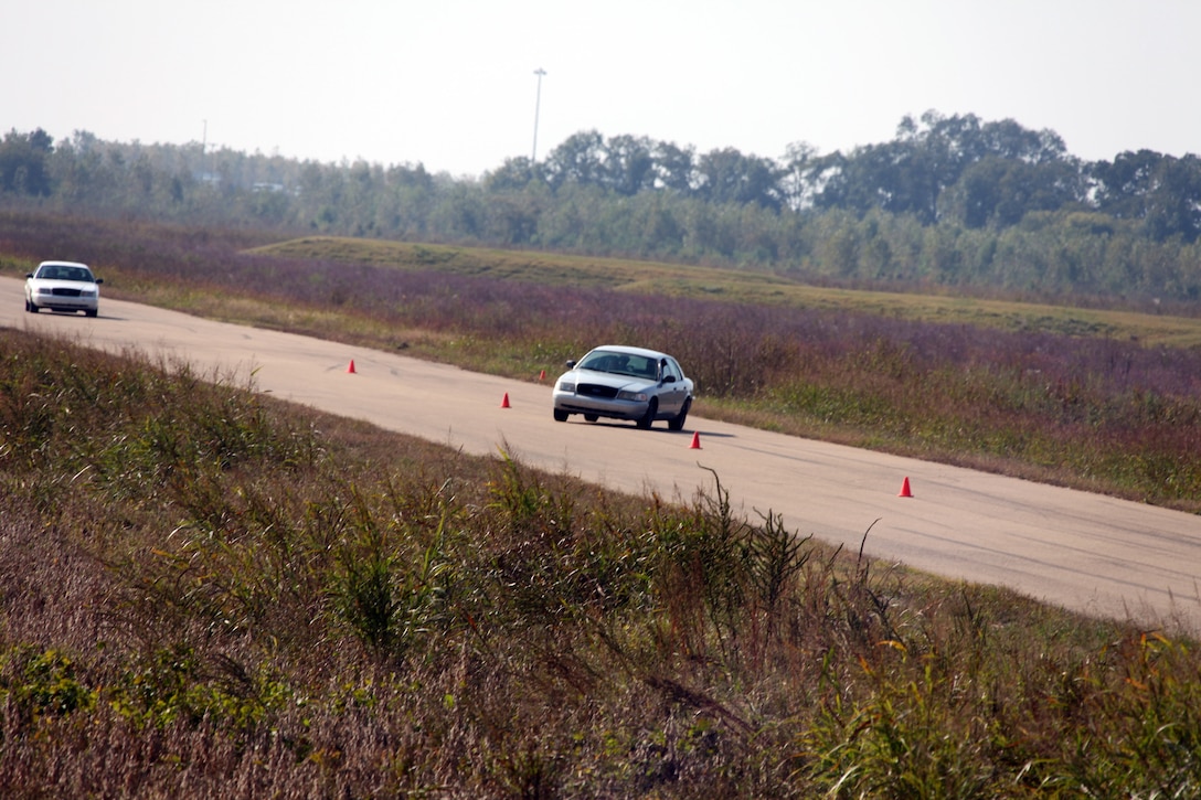 Marines and sailors with Special-Purpose Marine Air-Ground Task Force Africa negotiate through a series of cones at high speeds at the Tier 1 Group Training Facility in Crawfordsville, Ark., Oct. 13, 2012. Special-Purpose MAGTF Africa is training in preparation for its upcoming deployment.