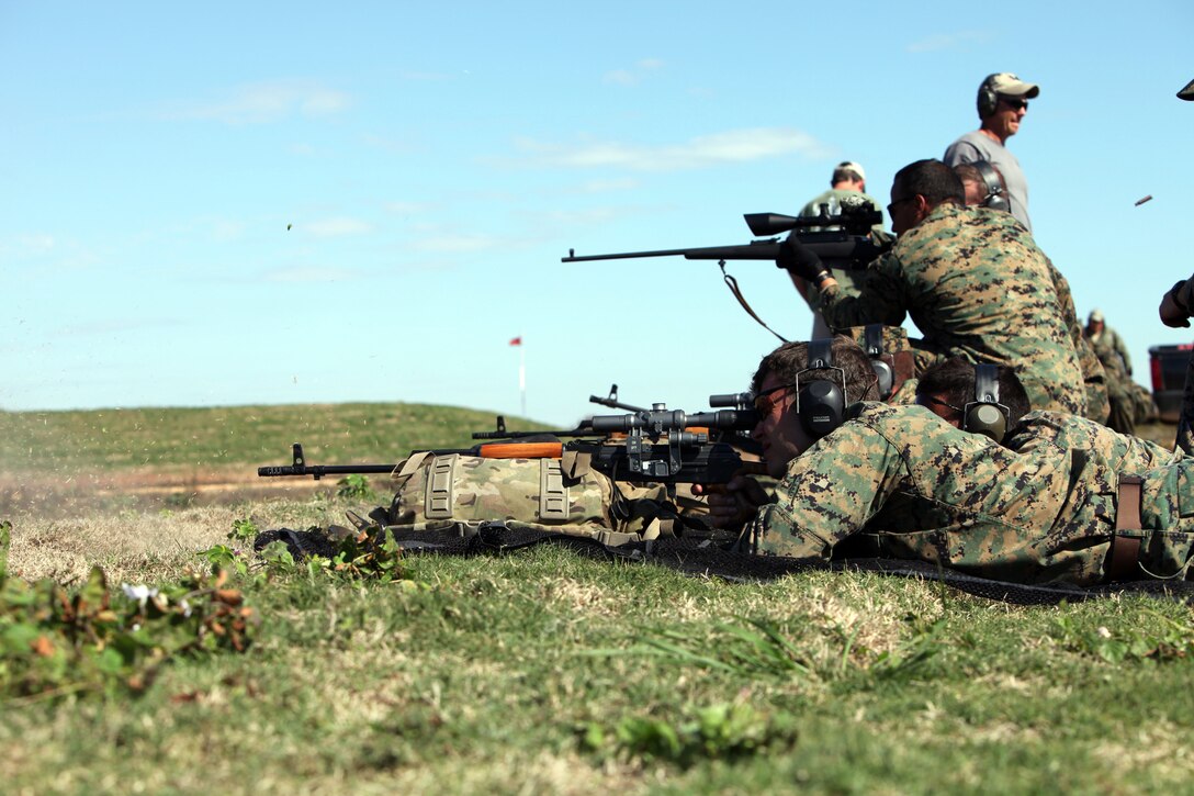 Marines with Special-Purpose Marine Air-Ground Task Force Africa fire foreign long-range rifles during a foreign weapons training session at Tier 1 Group Training Facility in Crawfordsville, Ark., Oct. 23, 2012. The Marines and Sailors of Special-Purpose MAGTF Africa learned ho to operate and maintain various foreign weapons in preparation for their upcoming deployment. 