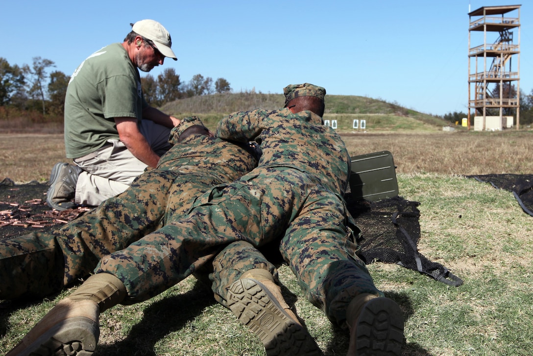 Marines with Special-Purpose Marine Air-Ground Task Force Africa, under supervision of an instructor, use the buddy system to fire a foreign machine gun during a training session on Tier 1 Group Training Facility in Crawfordsville, Ark., Oct. 23, 2012. The buddy system is used to help the shooter accurately engage the target quickly. The Marines and Sailors of Special-Purpose MAGTF Africa learned ho to operate and maintain various foreign weapons in preparation for their upcoming deployment. 