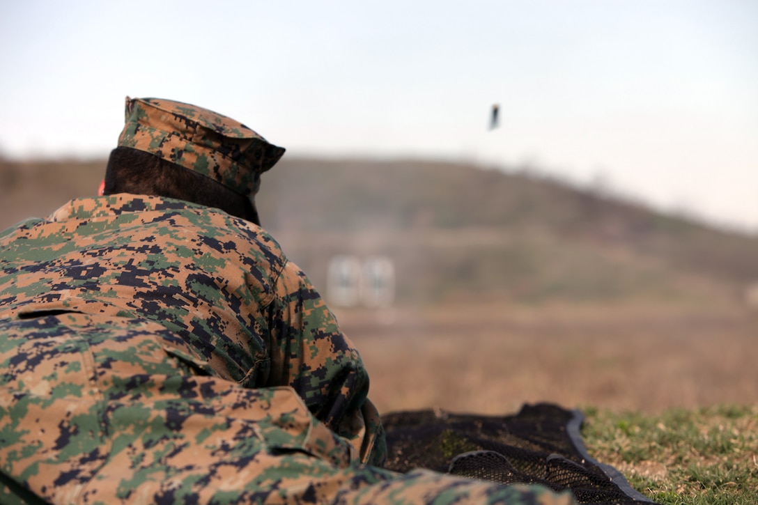 Cpl. Byron Naula, with Special-Purpose Marine Air-Ground Task Force Africa, fires an AK-47 assault rifle during a training session at Tier 1 Group Training Facility in Crawfordsville, Ark., Oct. 23, 2012. The Marines and Sailors of Special-Purpose MAGTF Africa learned ho to operate and maintain various foreign weapons in preparation for their upcoming deployment.