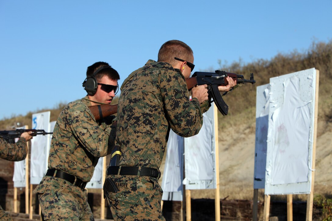 Cpl. Christian Jardine and Navy corpsman Christian Alexander with Special-Purpose Marine Air-Ground Task Force Africa, practice a team AK-47 assault riffle shooting drill at the Tier 1 Group Training Facility, Crawfordsville, Ark., Oct. 23, 2012. The Marines and Sailors of Special-Purpose MAGTF Africa learned how to operate and maintain various foreign weapons in preparation for their upcoming deployment. 