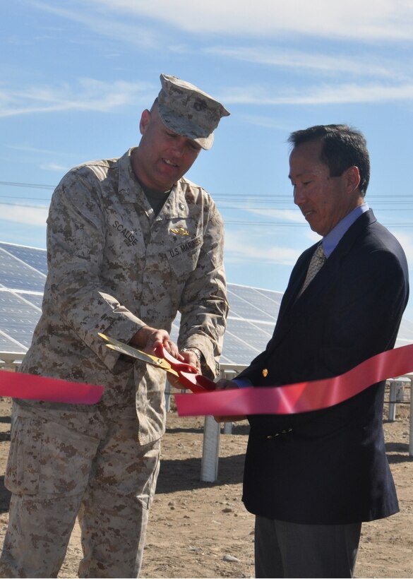 Marine Corps Logistics Base Barstow Commanding Officer, Col. Michael L. Scalise, and Assistant Secretary of the Navy, (Energy, Installation and Environment), Roger Natsuhara, cut the red ribbon, officially opening one of two solar farms aboard the base, Oct. 18. The two sites aboard the base include 2.73 acres on Nebo and 4.82 acres on the Yermo annex of the base.