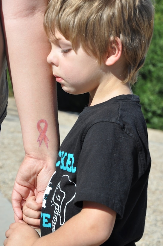 Colton Sheehy-Perry, son of Kayleigh Sheehy and Sgt. Benjamin Perry holds his mother’s hand while at the park aboard Marine Corps Logistics Base Barstow, Calif., Oct. 22.