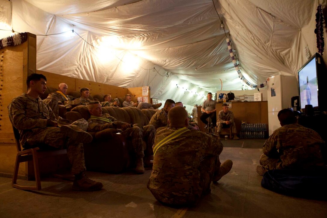 U.S. Marines, Sailors and Soldiers watch a movie in a morale center located on Manas Air Base, Chuy province, Kyrgyzstan, Oct. 13, 2012. Manas Air Base is a staging point for U.S. forces traveling to and from Afghanistan in support of Operation Enduring Freedom. (U.S. Marine Corps photo by Cpl. Alejandro Pena/Released)


