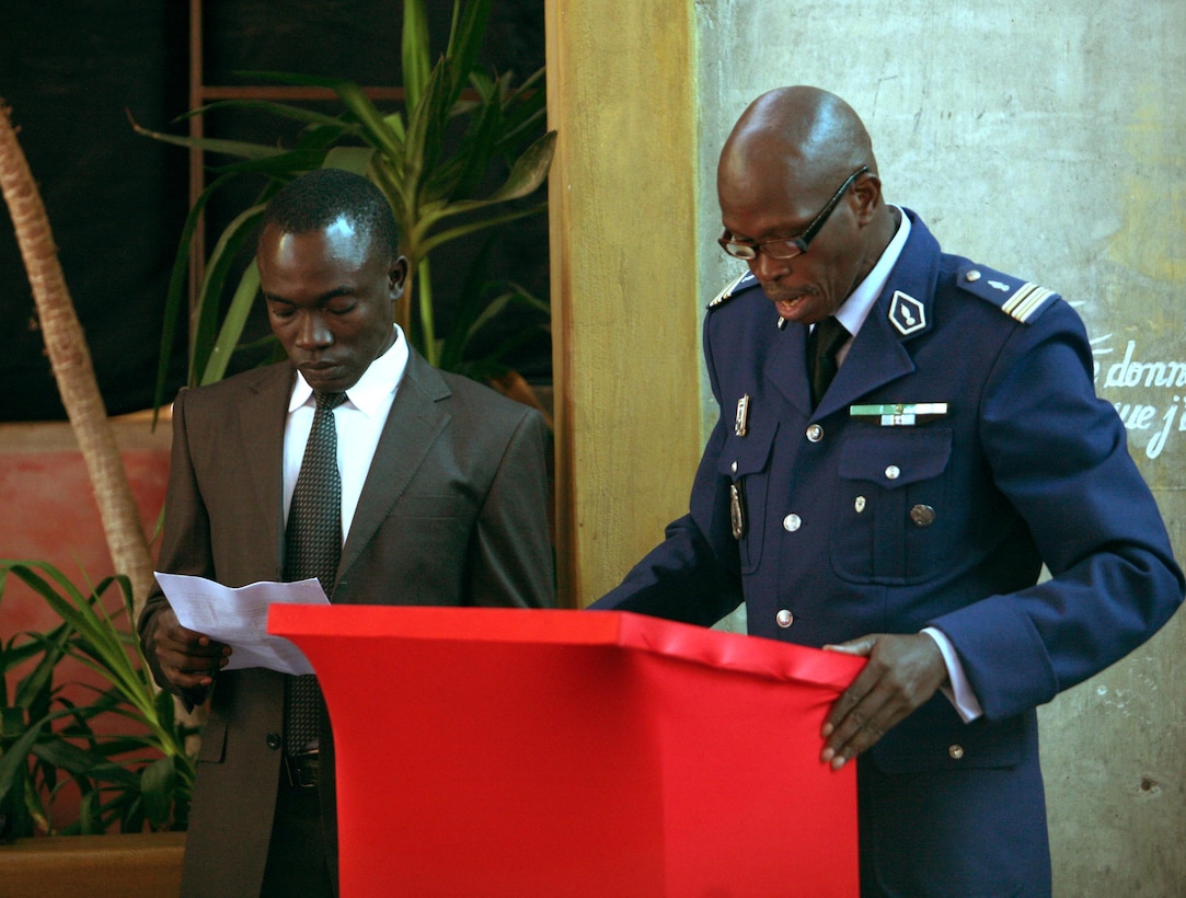 Senegalese Lt. Col. Ddse Diouf, and interpreter Massiga Seck presents a speech during the second iteration of the Military Intelligence Non-commissioned Officer Course- Africa. MINOC-A II, a seven-week course that was held here, is the first iteration of the course on the continent of Africa and enhances capacity for intelligence skills and techniques while providing a combined-forces environment to promote collaboration methods with the region’s military-intelligence community. Countries that participated in MINOC-A II include the nations of Algeria, Burkina Faso, Chad, Mauritania, Tunisia, Senegal, Canada and the U.S. 