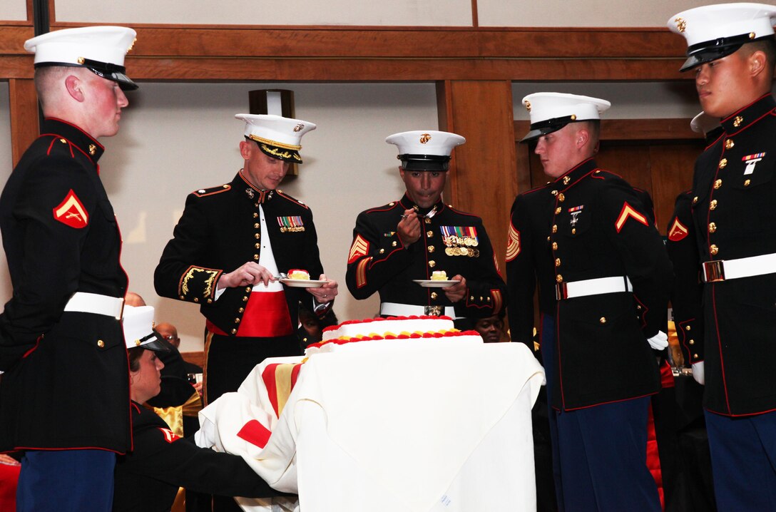 Lt. Col. Jesse A. Kemp, the commanding officer of 2nd Supply Battalion, 2nd Marine Logistics Group, and Sgt. Joseph M. Perez, an instructor with the School of Infantry-East, share the first bite of cake at 2nd Supply Battalion’s Marine Corps Birthday ball in New Bern, N.C., Oct. 29, 2012. Perez spoke as the honored guest for the event, which included members of the Montford Point Marines.