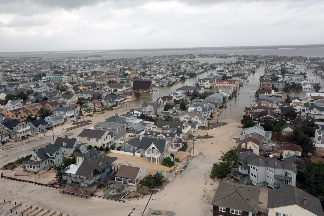 Hurricane Sandy devastated much of the northeastern coast when it made landfall Oct. 29. Winds up to 80 mph and floodwaters up to 14 feet blanketed New York, bursting a transformer, which caused a fire in the Queens neighborhood of Rockaway Beach, destroying 111 homes. The fire and floodwaters trapped many residents, who had to be rescued by local authorities and Marines from the 6th Communications Battalion, headquartered in Brooklyn, N.Y. (U.S. Air Force photo by Master Sgt. Mark C. Olsen/released)