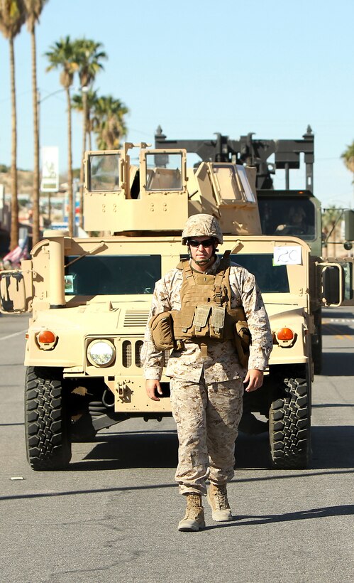 1st Lt. Bryan Colbourn, logistics officer, Combat Logistics Battalion 7 ground guides a convoy in the Annual Pioneer Days Parade in Twentynine Palms.