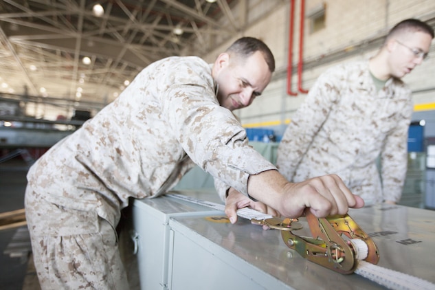 Gunnery Sgt. Walter K. Saucier, a logistics chief with Marine Medium Tiltrotor Squadron (VMM) 266 Reinforced, from Grapeland, Texas, prepares containers to be transported with Marines and sailors of the 26th Marine Expeditionary Unit, which deployed aboard the USS Wasp (LHD-1) Nov. 1, 2012, in support of Hurricane Sandy disaster relief efforts in New York and New Jersey. The 26th MEU is able to provide generators, fuel, clean water, and helicopter lift capabilities to aid in disaster relief efforts. The 26th MEU is currently conducting pre-deployment training, preparing for their departure in 2013. As an expeditionary crisis response force operating from the sea, the MEU is a Marine Air-Ground Task Force capable of conducting amphibious operations, crisis response, and limited contingency operations.