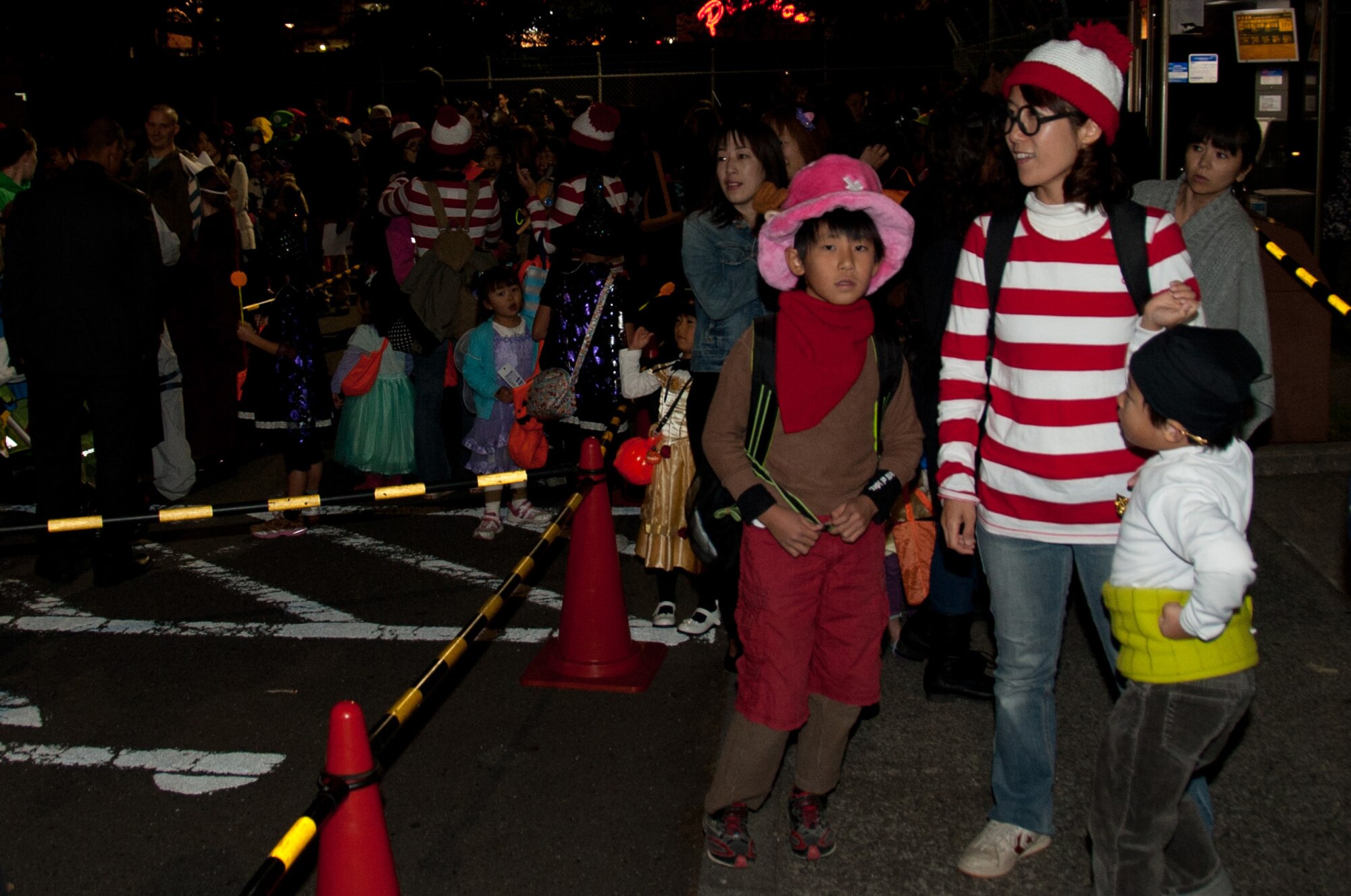 YOKOTA AIR BASE, Japan -- Visitors dressed in costumes wait in line to register for trick-or-treating on Oct. 31, 2012, at Yokota Air Base, Japan. Approximately 1,500 visitors came on base for Halloween. (U.S. Air Force photo by Airman 1st Class Desiree Economides)