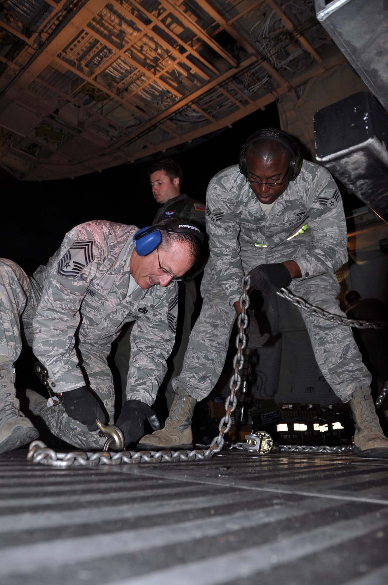 Reservists and technicians from March Air Reserve Base, Calif., answered the President's call to 'lean forward' with Hurricane Sandy relief efforts here Nov. 1, 2012, by loading Southern California Edison equipment onto a Travis Air Force Base C-5 Galaxy and a Joint Base Lewis-McChord C-17 Globemaster III. Here an Edison truck is secured in the cargo bay of a C-5. (U.S. Air Force photo/Linda Welz)