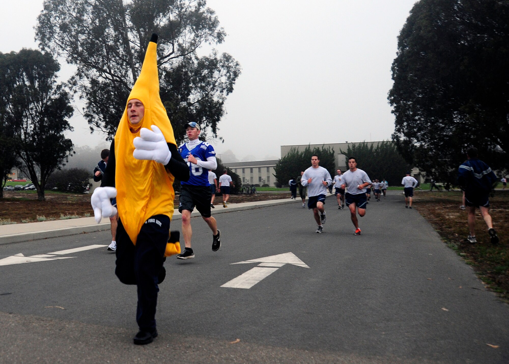 VANDENBERG AIR FORCE BASE, Calif. -- Capt. Phil Wagonbach, 4th Space Launch Squadron engineer, leads a group of runners to the finish line at the monthly wing run here Wednesday, Oct. 31, 2012. Team V members were invited to participate in costume in celebration of Halloween. (U.S. Air Force photo/Michael Peterson)