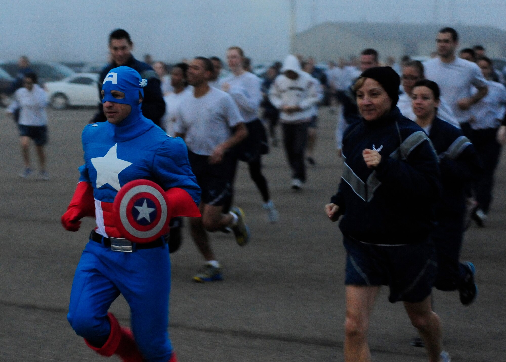 VANDENBERG AIR FORCE BASE, Calif. -- Lt. Col. Daniel Murray, 30th Medical Group aerospace medicine chief, leads a group of runners dressed during the Wing Run here Wednesday, Oct. 31, 2012. Team V members were invited to participate in costume in celebration of Halloween. (U.S. Air Force photo/Michael Peterson)