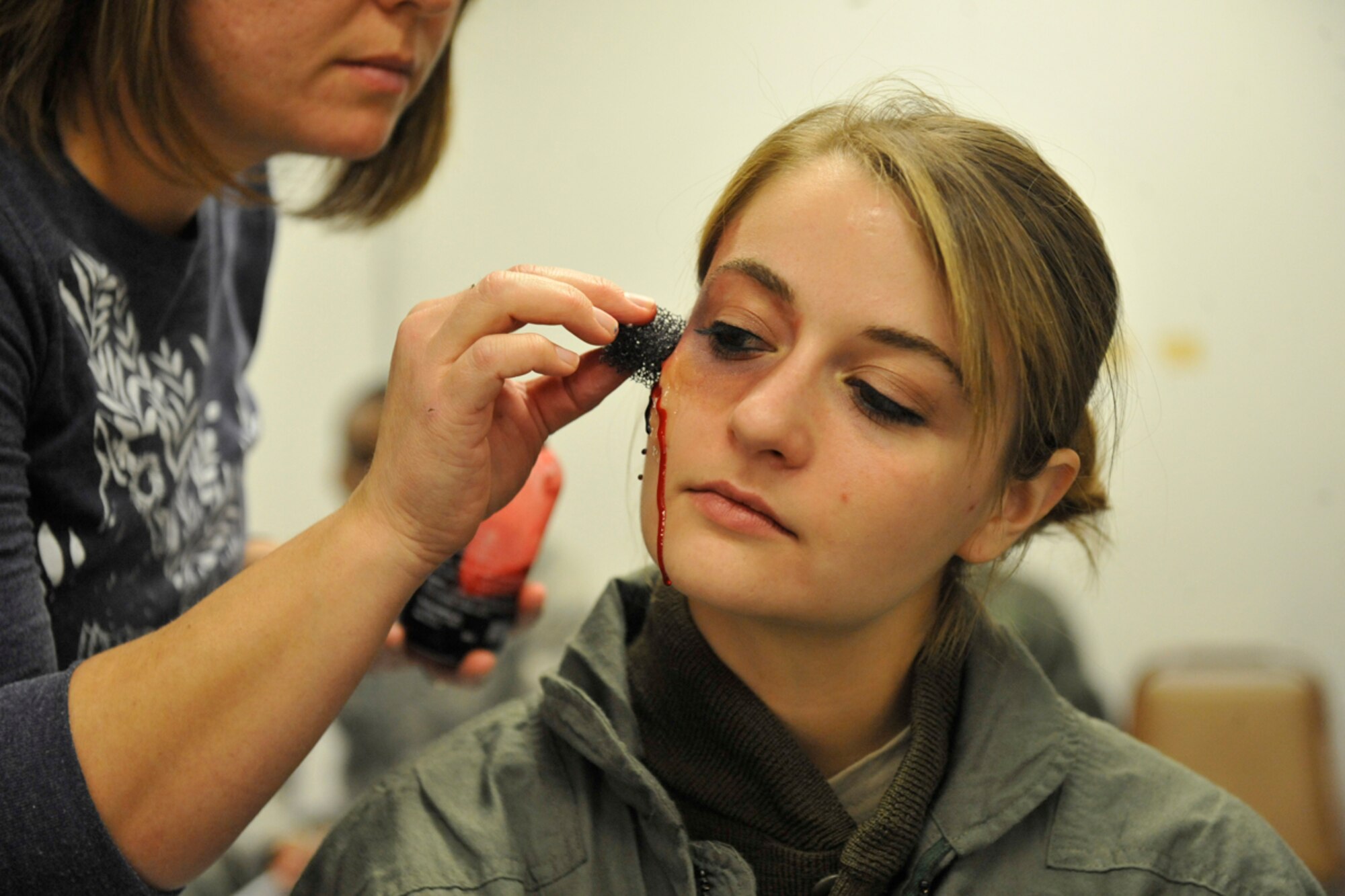 JOINT BASE ELMENDORF-RICHARDSON, Alaska -- . The application of moulage is used during the exercise to give the perception of bodily injuries inflicted to casualties. (U.S. Air Force photo/ Airman Ty-Rico Lea)