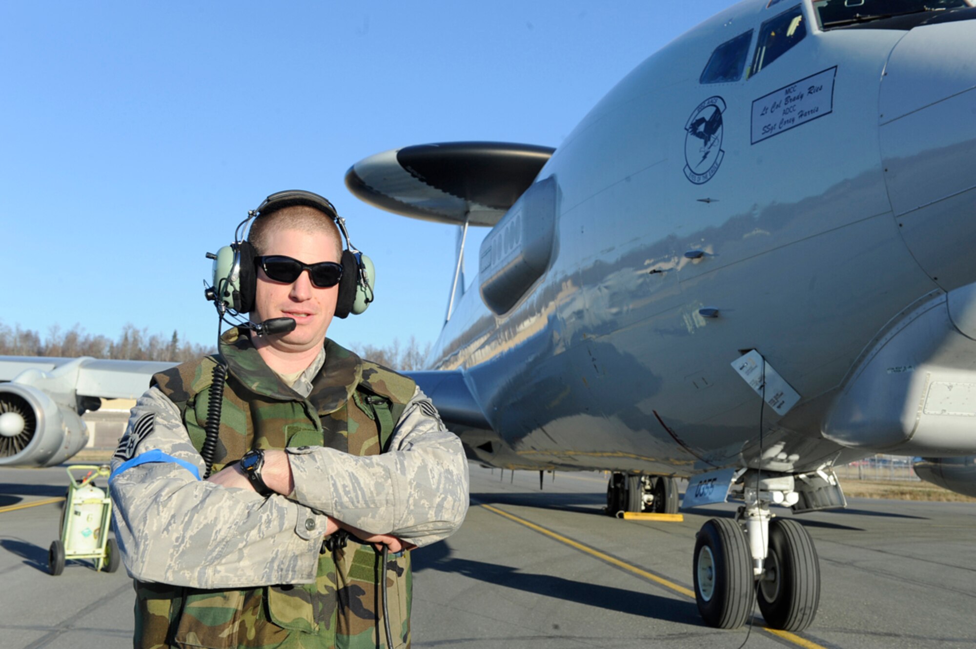 Air Force Staff Sgt. Albert Brown communicates with the pilots of an E-3 Sentry prior to take off at Joint Base Elmendorf-Richardson, Alaska, during Exercise Polar Force 12-7 Oct. 24. The exercise was designed to test base preparedness for various scenarios.Brown is a 962nd Aircraft Maintenance Unit E-3 crew chief from Redding, Calif. (U.S. Air Force photo/Staff Sgt. Robert Barnett)