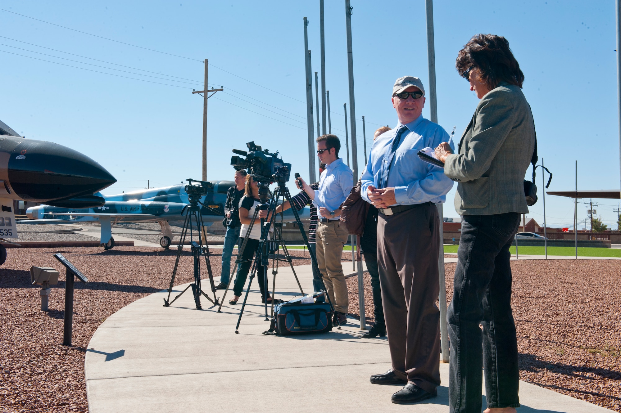 James Burrett, 49th Wing historian, second from right, gives a heritage briefing to several media outlets at Holloman Air Force Base, N.M., Oct. 30. In addition to Burret’s responsibility to write annual histories of the base, he also gives briefings and maintains the museums here. (U.S. Air Force photo by Airman 1st Class Daniel E. F. Liddicoet)