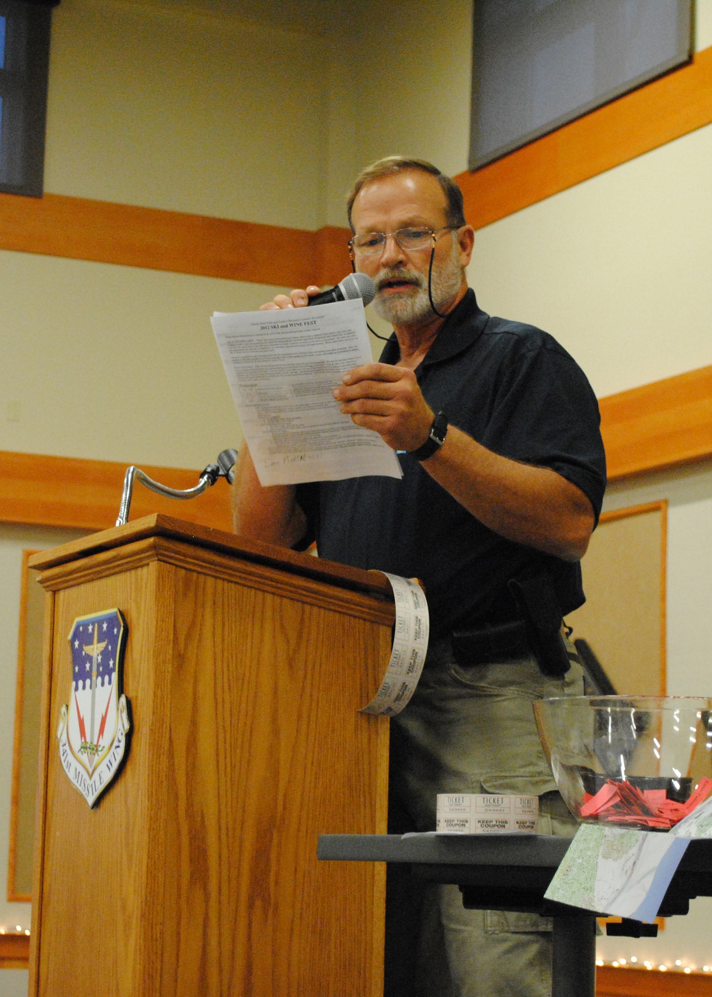 Jim Beisel, 341st Force Support Squadron Outdoor Recreation programmer, announces upcoming ODR trips and classes, before drawing from a bowl of raffle tickets during the annual Ski and Wine Festival. Various ski specialists provided helpful tips on purchasing new equipment, snow conditions and skiing in Montana. (U.S. Air Force photo/Airman 1st Class Katrina Heikkinen)