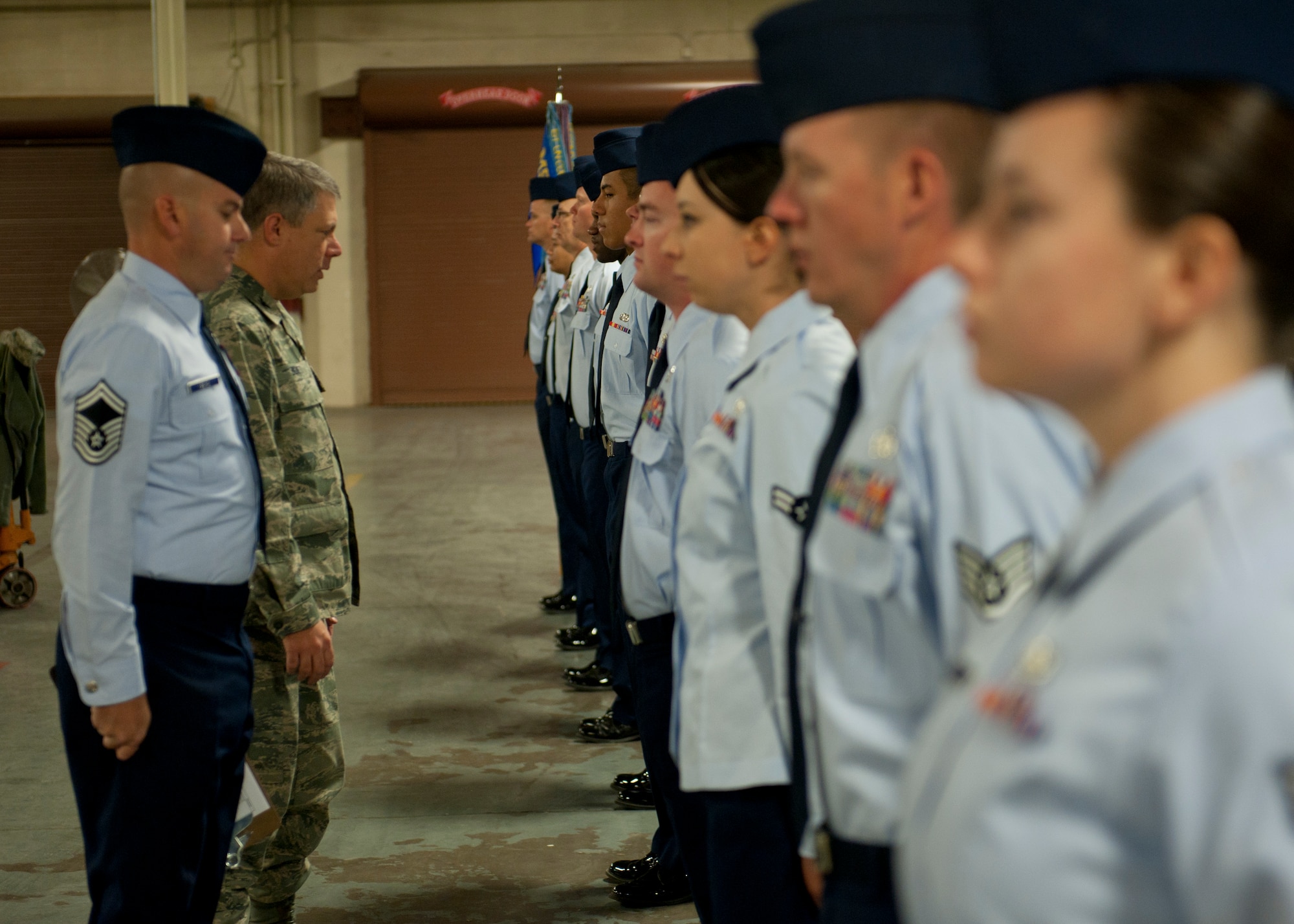 Colonel Kevin Bennett, 49th Mission Support Group commander, performs an open-ranks uniform inspection of Airmen in the 49th Logistics Readiness Squadron at Holloman Air Force Base, N.M., Oct. 30. Representatives of all grades in both the enlisted and officer tiers were chosen from every 49th LRS flight to have their uniforms inspected. (U.S. Air Force photo by Airman 1st Class Daniel E. F. Liddicoet)