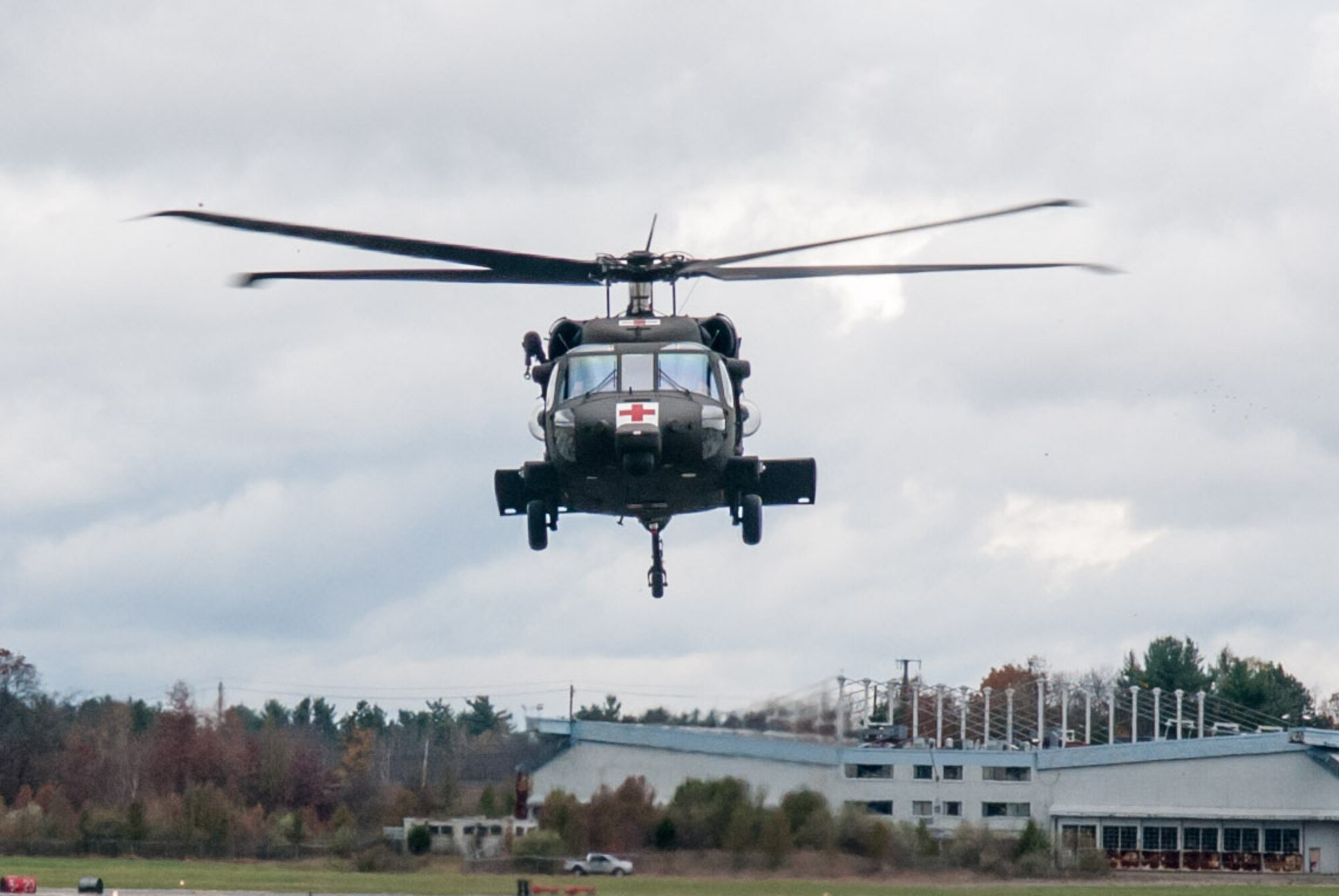 HANSCOM AIR FORCE BASE, Mass. -- A UH-60 Blackhawk helicopter ferrying members of the 10th Mountain Division Combat Aviation Brigade arrives at Hanscom Oct. 31. The brigade is at Hanscom as part of the USNORTHCOM Defense Support of Civil Authorities mission that directs the command to plan and anticipate action that it may need to take to support civil authorities. USNORTHCOM plays an important role in disaster response; however, all efforts for Hurricane Sandy are in support of FEMA, working closely with state and local officials. (U.S. Air Force photo by Rick Berry)