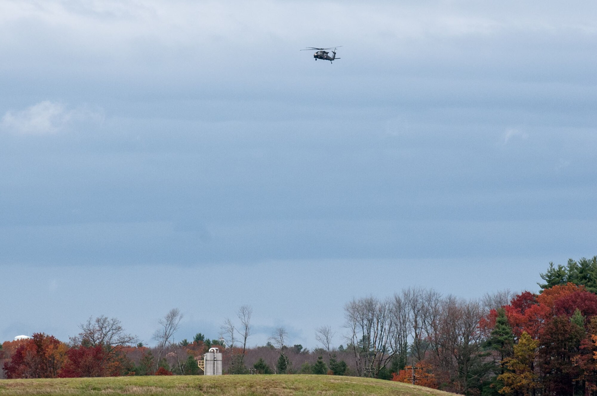 HANSCOM AIR FORCE BASE, Mass. -- A UH-60 Blackhawk helicopter ferrying members of the 10th Mountain Division Combat Aviation Brigade arrives at Hanscom Oct. 31. The brigade is at Hanscom as part of the USNORTHCOM Defense Support of Civil Authorities mission that directs the command to plan and anticipate action that it may need to take to support civil authorities. USNORTHCOM plays an important role in disaster response; however, all efforts for Hurricane Sandy are in support of FEMA, working closely with state and local officials. (U.S. Air Force photo by Rick Berry)