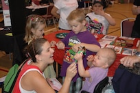 Heather Strable and her children (from left) Landen, 5, Langston, 6, and Ellyson, 3, enjoy the Joint Base San Antonio Special Needs Resource Fair and Activity Day Oct. 13 at Morgan’s Wonderland. Langston and Landen attend Randolph Elementary School. (U.S. Air Force photo by Robert Goetz)