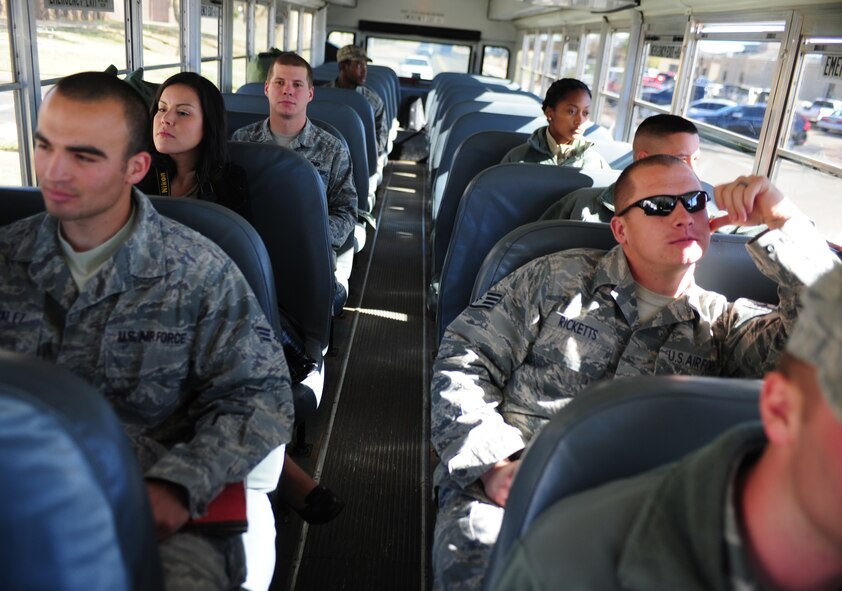 Airmen on a simulated deployment ride out to the flightline during an exercise at Cannon Air Force Base, N.M., Oct. 29, 2012. The exercise consisted of multiple squadrons working together to transport troops and supplies from Cannon to their simulated deployed location at Melrose Air Force Range, N.M., and was designed to prepare Air Commandos for  real-world events. (U.S. Air Force photo/Airman 1st Class Ericka Engblom)