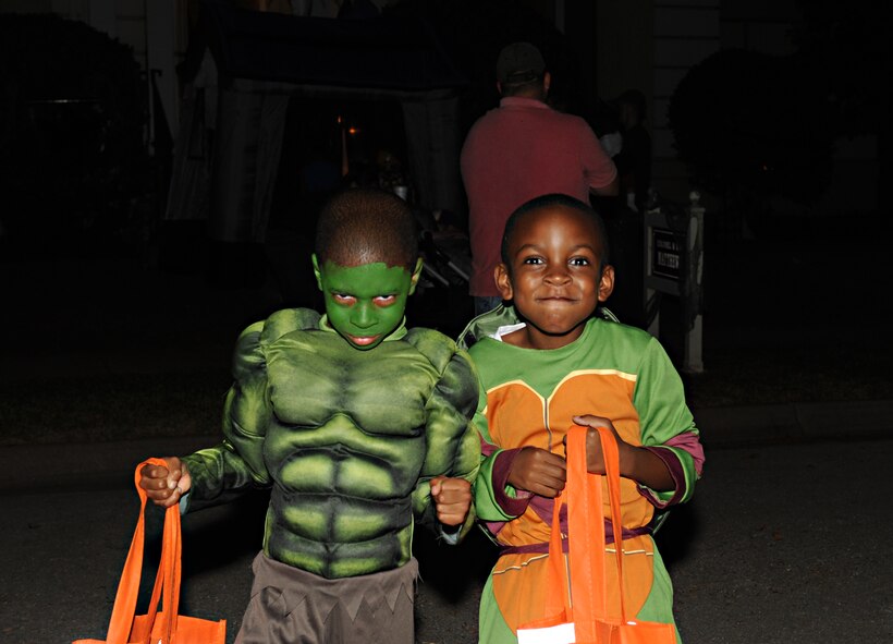 Costumed children pose for a photo during trick-or-treating on Barksdale Air Force Base, La. Oct. 31. Barksdale Airmen and their families dressed up for Halloween and trick-or-treated throughout the housing areas. (U.S. Air Force photo/Airman 1st Class Benjamin Gonsier)(RELEASED)