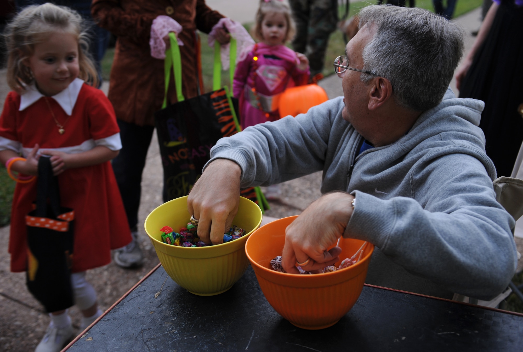 Costumed children anticipate receiving candy during trick-or-treating on Barksdale Air Force Base, La., Oct. 31. From 5:30 p.m. to 8:00 p.m. the base housing areas was open to Barksdale Airmen and their families for trick-or-treating. (U.S. Air Force photo/Airman 1st Class Benjamin Gonsier)(RELEASED)
